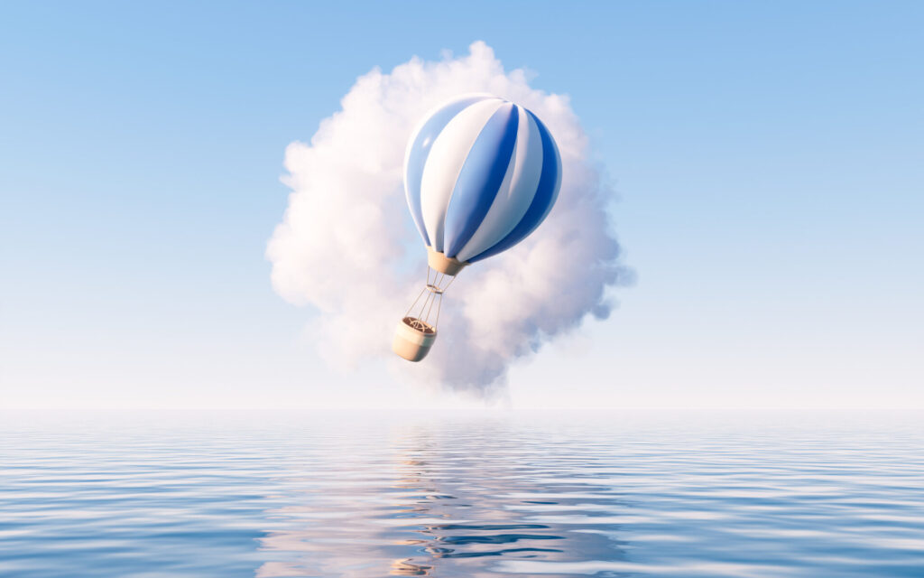 hot air balloon floating above water with clouds what is multi-cloud