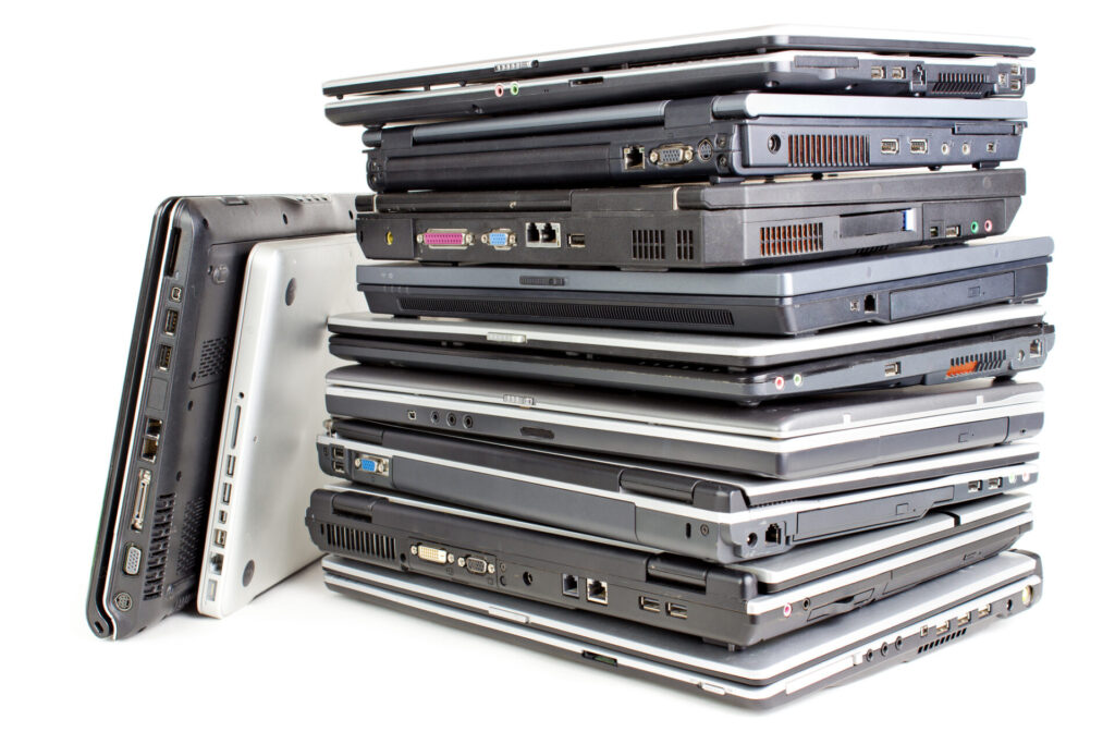 stack of old laptops